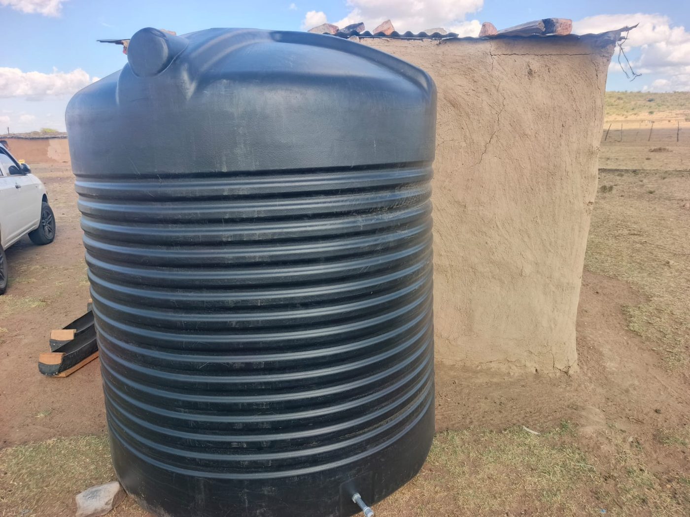 A water storage tank at a homestead in the community ITF serves